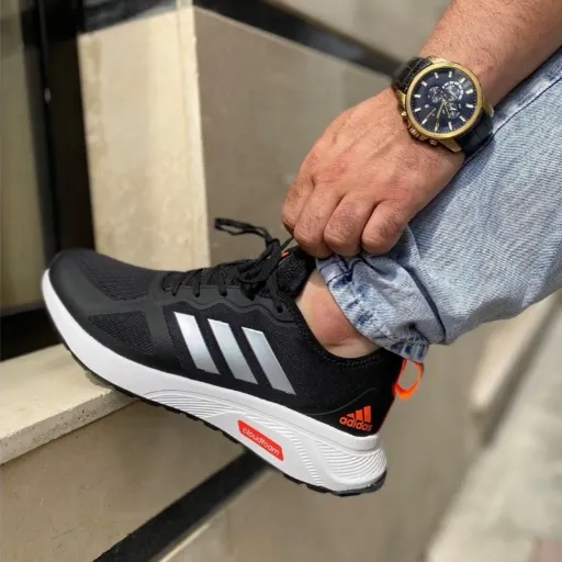 کفش ورزشی و رانینگ زنانه آدیداس مدل Adidas Cloudfoam - مشکی با جزئیات نارنجی و زیره سفید | مستر کوالیتی