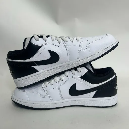 کتونی نایکی ایر جردن ۱ لو (Nike Air Jordan 1 Low) - رویه چرمی تمام سفید با سووش و پاشنه مشکی | مستر کوالیتی