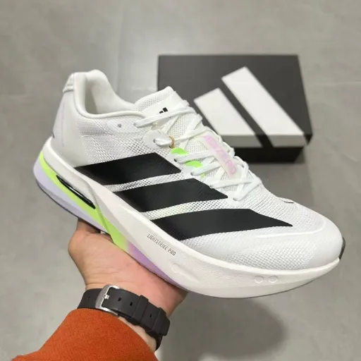 کفش دویدن و اسپرت زنانه آدیداس مدل Adidas Adizero Adios Pro / Boston - رنگ سفید مشکی با جزئیات نئونی | مستر کوالیتی