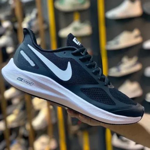 کتونی نایکی ایر زوم گاید سایز بزرگ (Nike Air Zoom Structure / Guide) - رویه پارچه‌ای مشکی با لوگو و زیره لژدار طبی سفید | مستر کوالیتی
